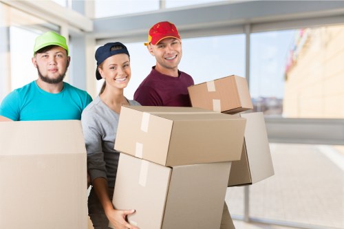 Man with van loading furniture for transport