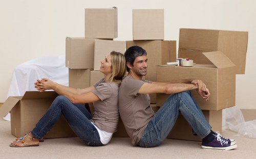 Helper loading furniture into a van for an Enfieldhighway move