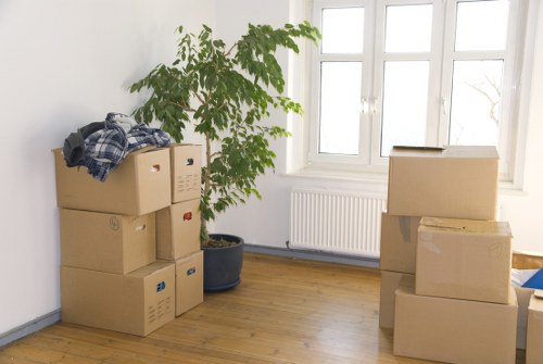 Professional movers loading furniture and boxes for an Enfieldhighway home move