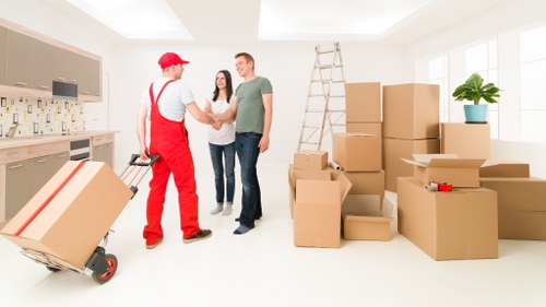 Packed household boxes and wrapped furniture ready for transport