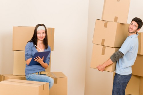 Movers loading household items into a van for a property move